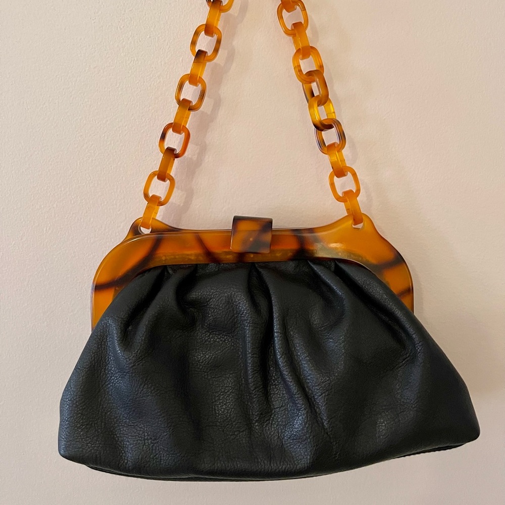 Black leather designer mini purse with tiger accent pattern handle
